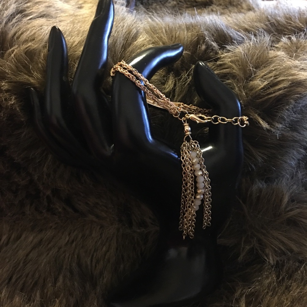 Gold tone rhinestone bar tassel chain bracelet